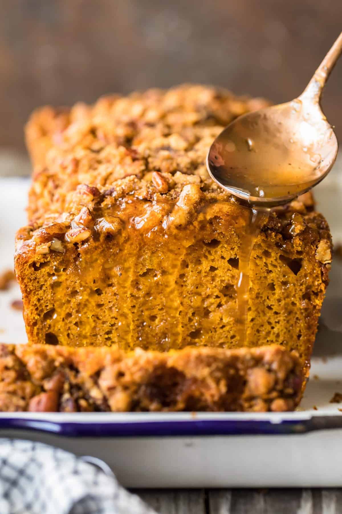 Apple cider sauce being spooned over the bread