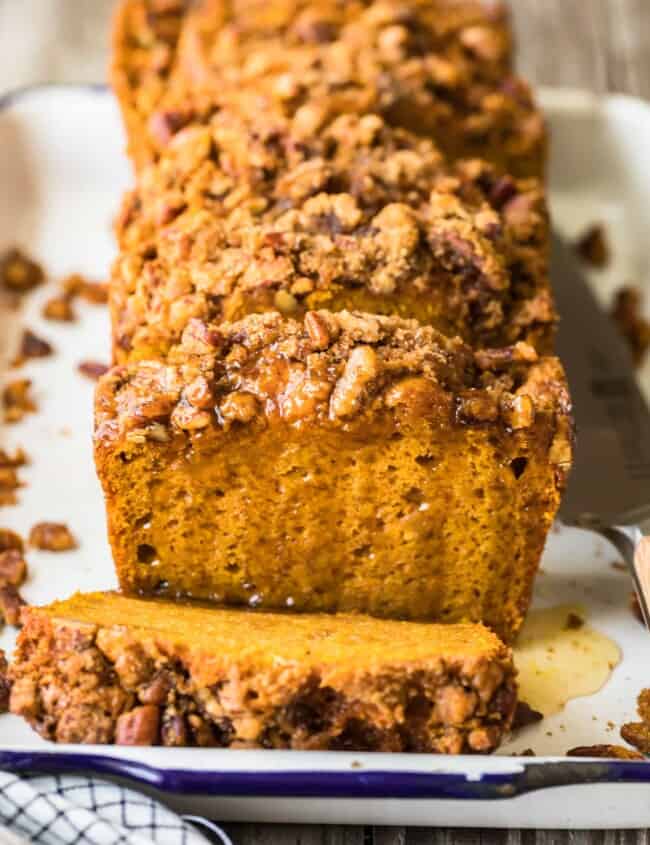 sliced loaf of oatmeal pumpkin bread on a plate