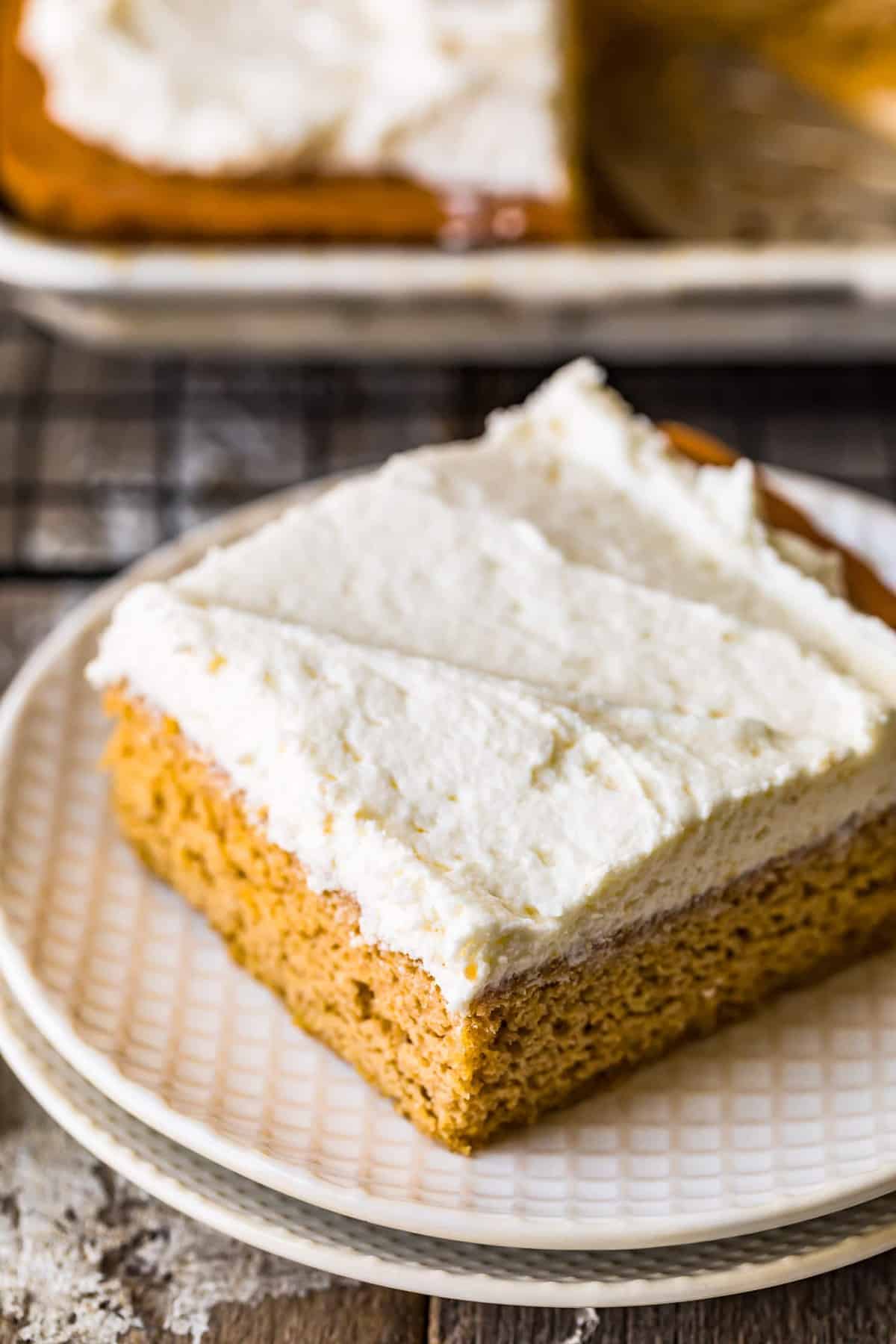 A pumpkin bar served on a white patterned plate