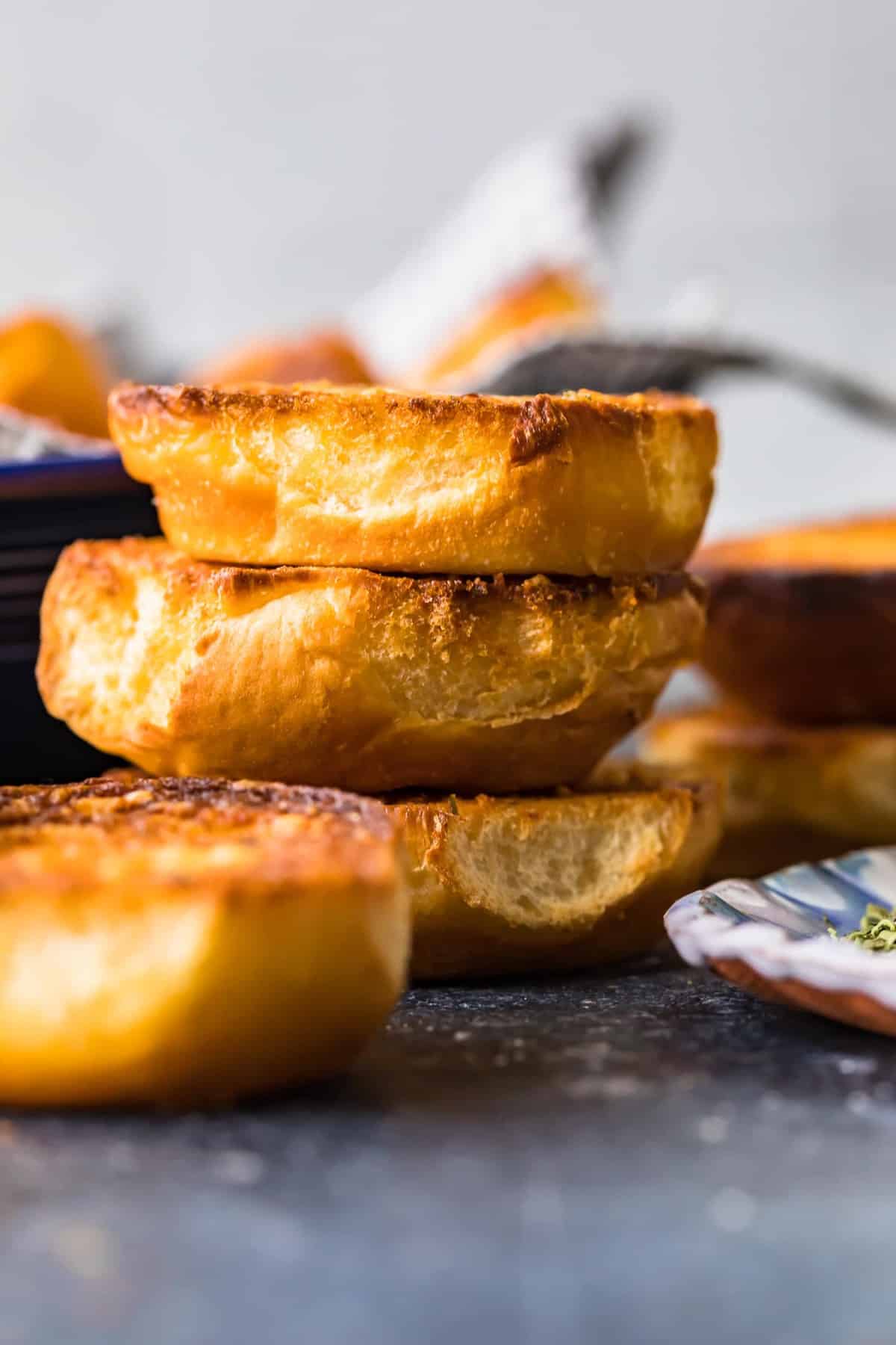 Parmesan Crusted Hawaiian Rolls stacked on top of each other