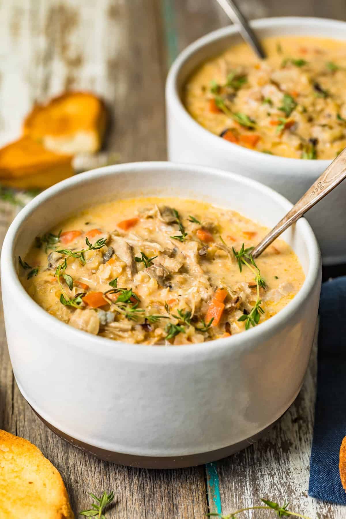 Turkey wild rice soup served with fresh herbs