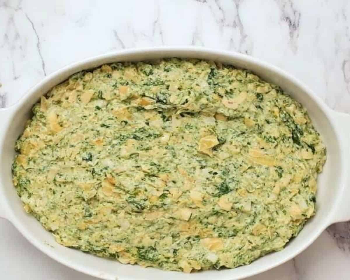 Spinach artichoke dip in a baking dish.