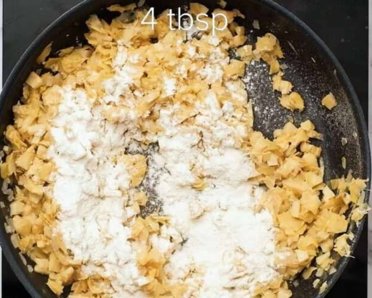 Flour sprinkled over the spinach and onion mixture.