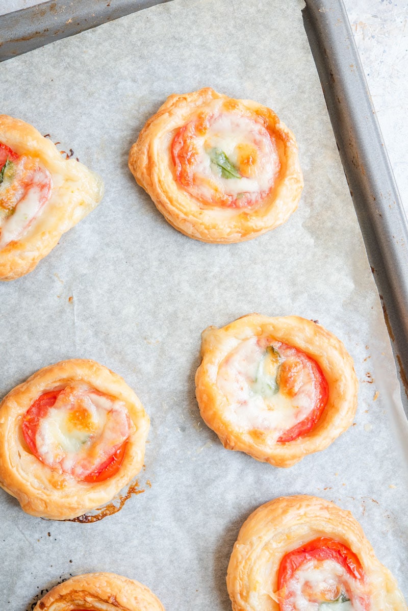 Mini caprese tarts on a baking tray