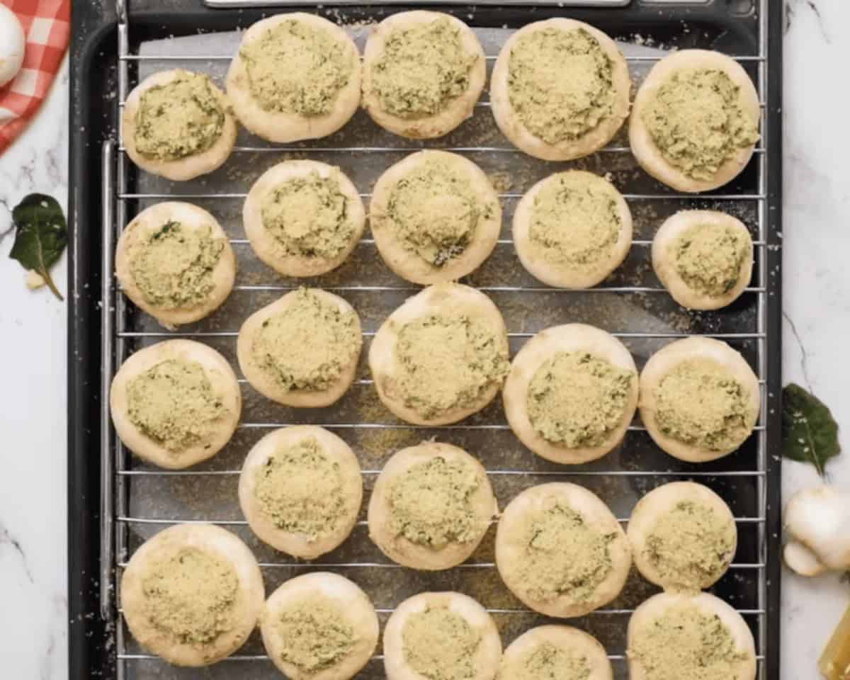 Stuffed mushrooms with breadcrumb topping sprinkled on top.