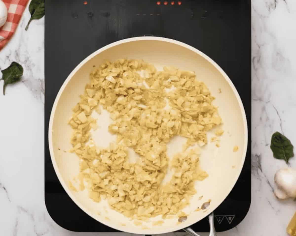 Cooking artichokes in a skillet.