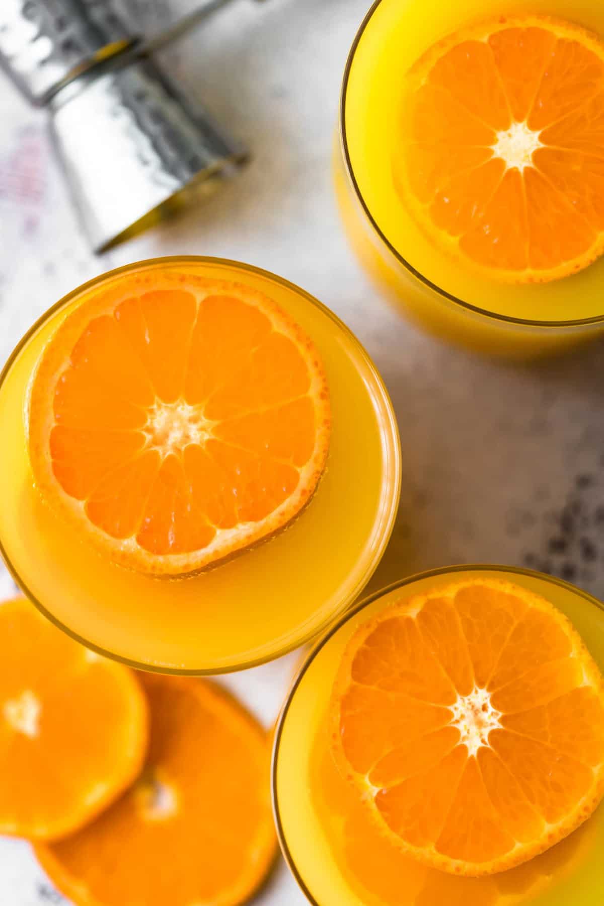 top view of drinks with slices of oranges in them