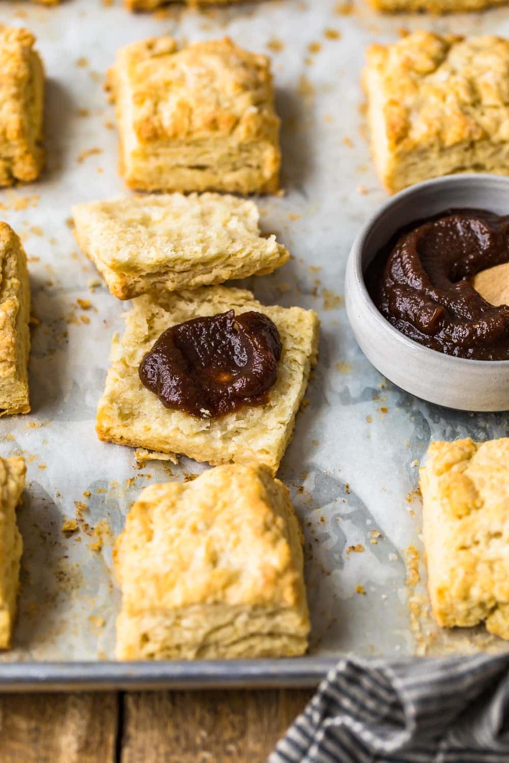 Easy Buttermilk Biscuits cut in half and spread with a sauce