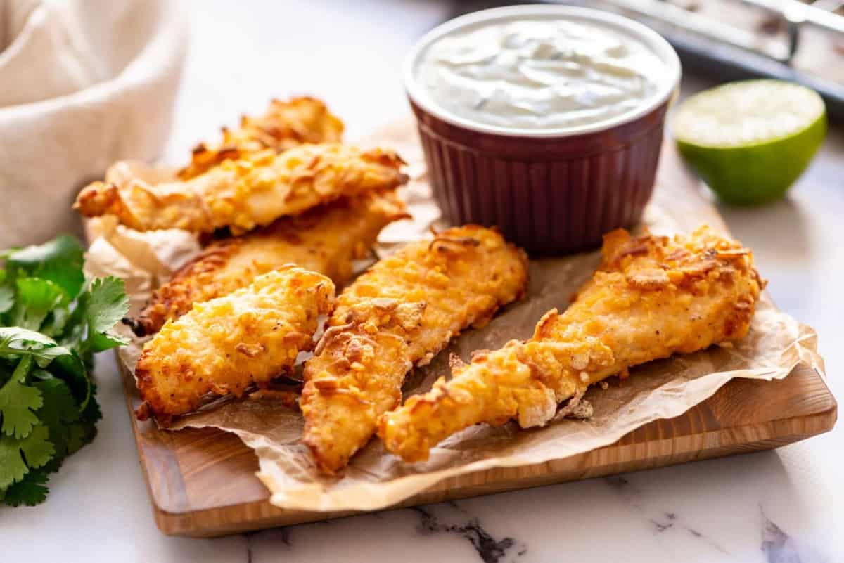 Chicken fingers served with a creamy dip