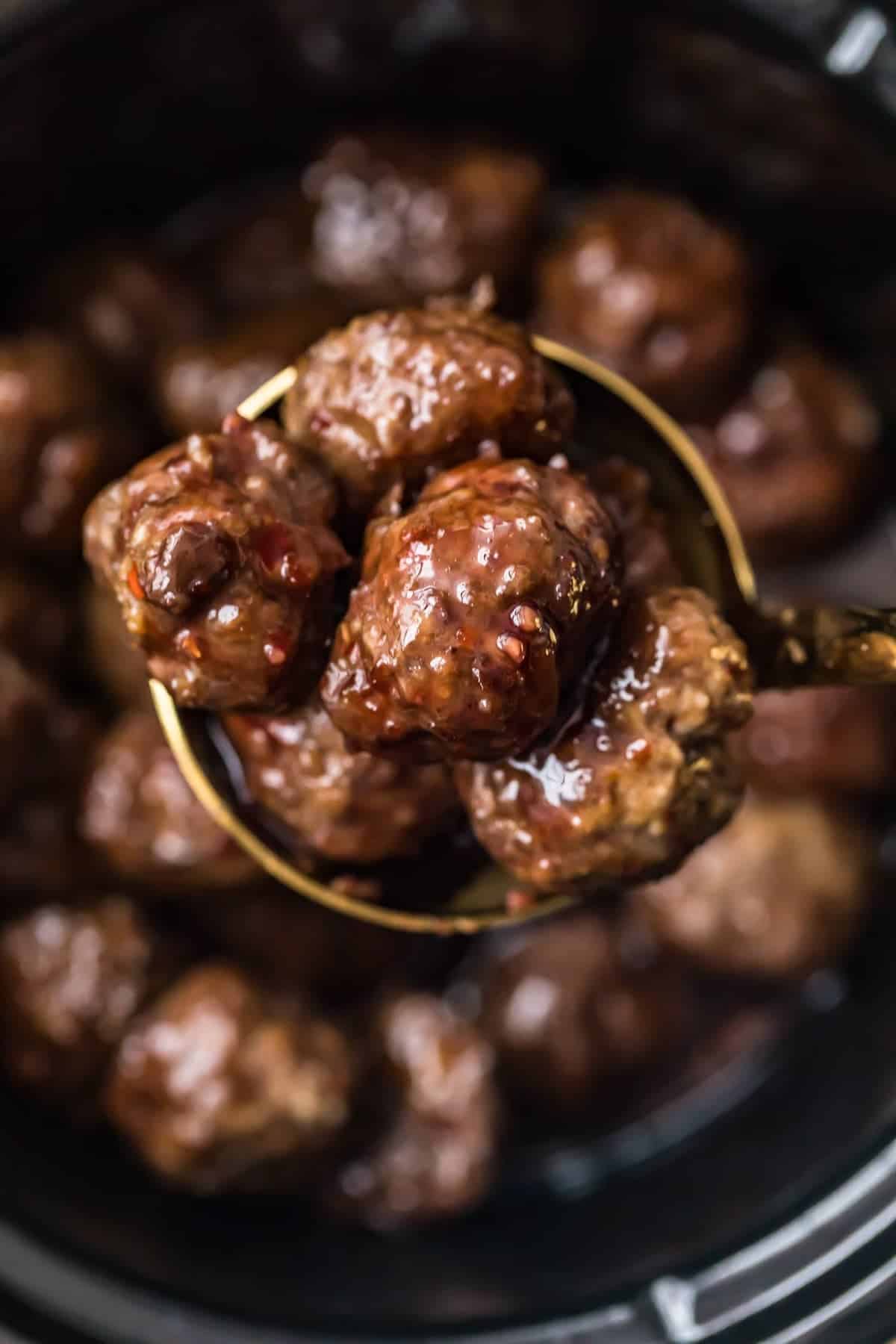 Grape Jelly Meatballs on a serving spoon