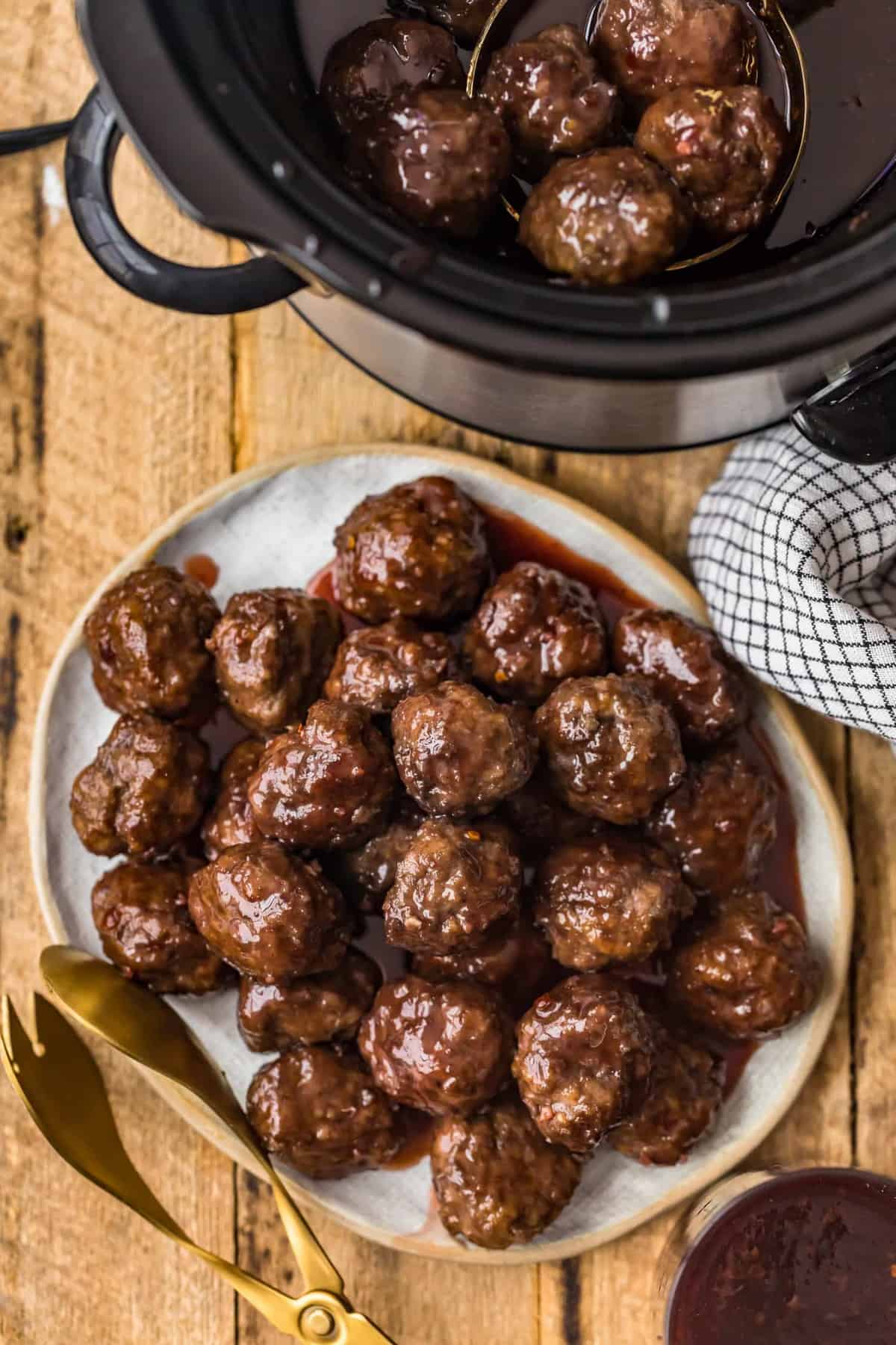 Meatballs being transferred to a serving dish