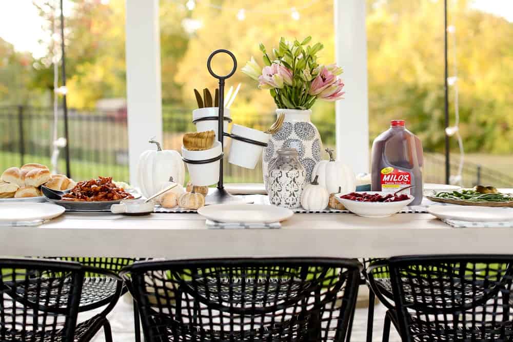 A table set with Thanksgiving Decor and Milos Sweet Tea