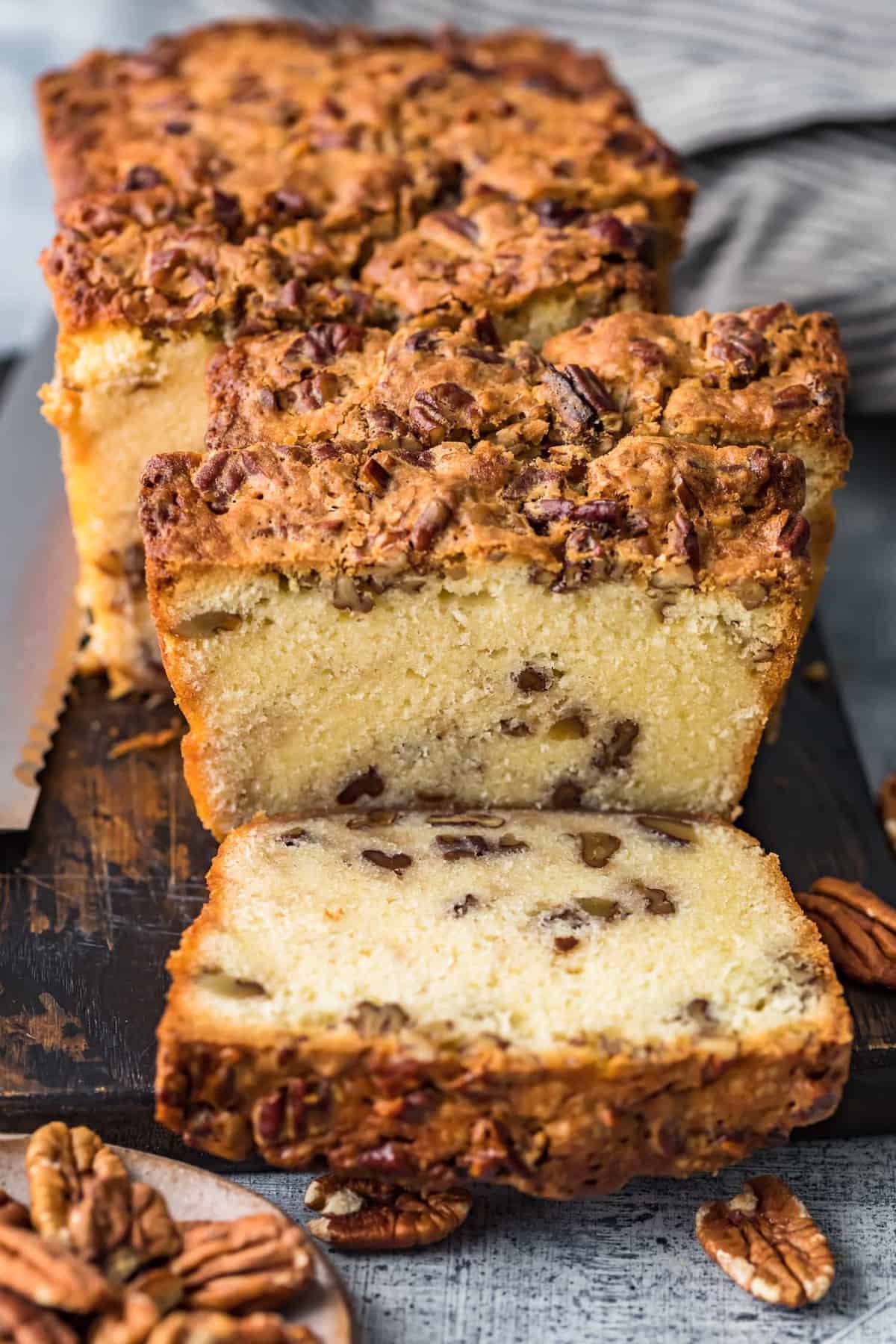 Pecan Pie Pound Cake cut into slices on a board