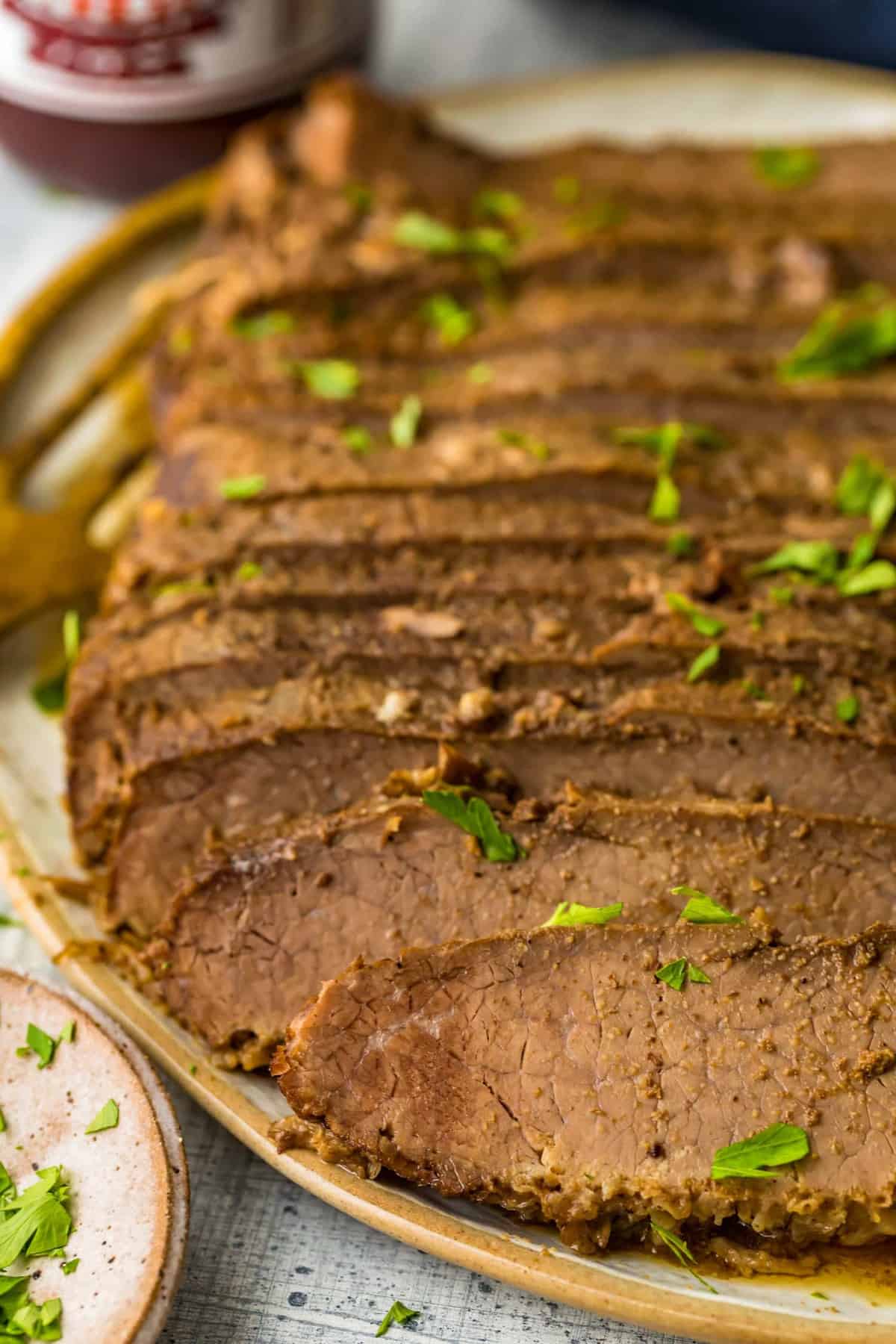 Slices of beef garnished with herbs