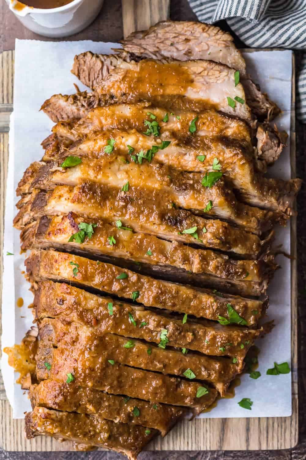 Sliced beef garnished with fresh herbs