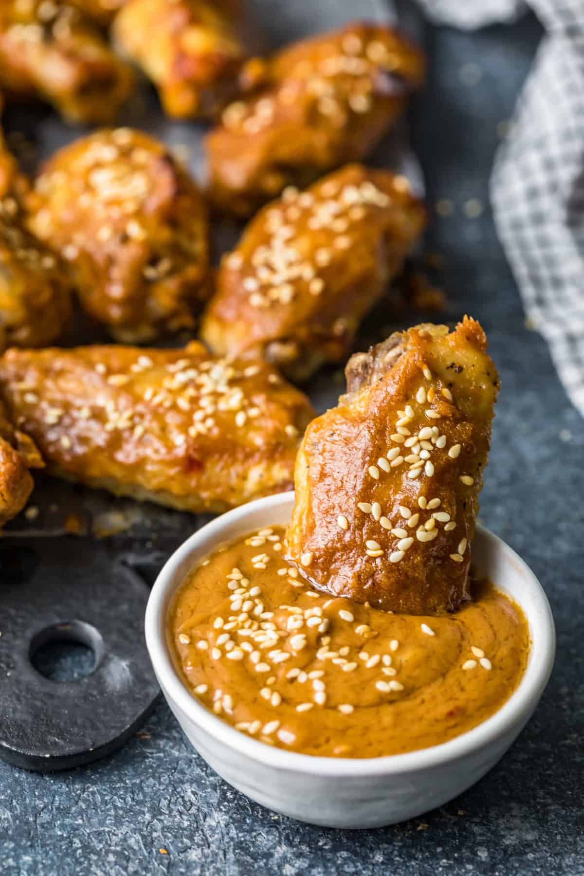 A Thai Chicken Wing dippe in peanut sauce