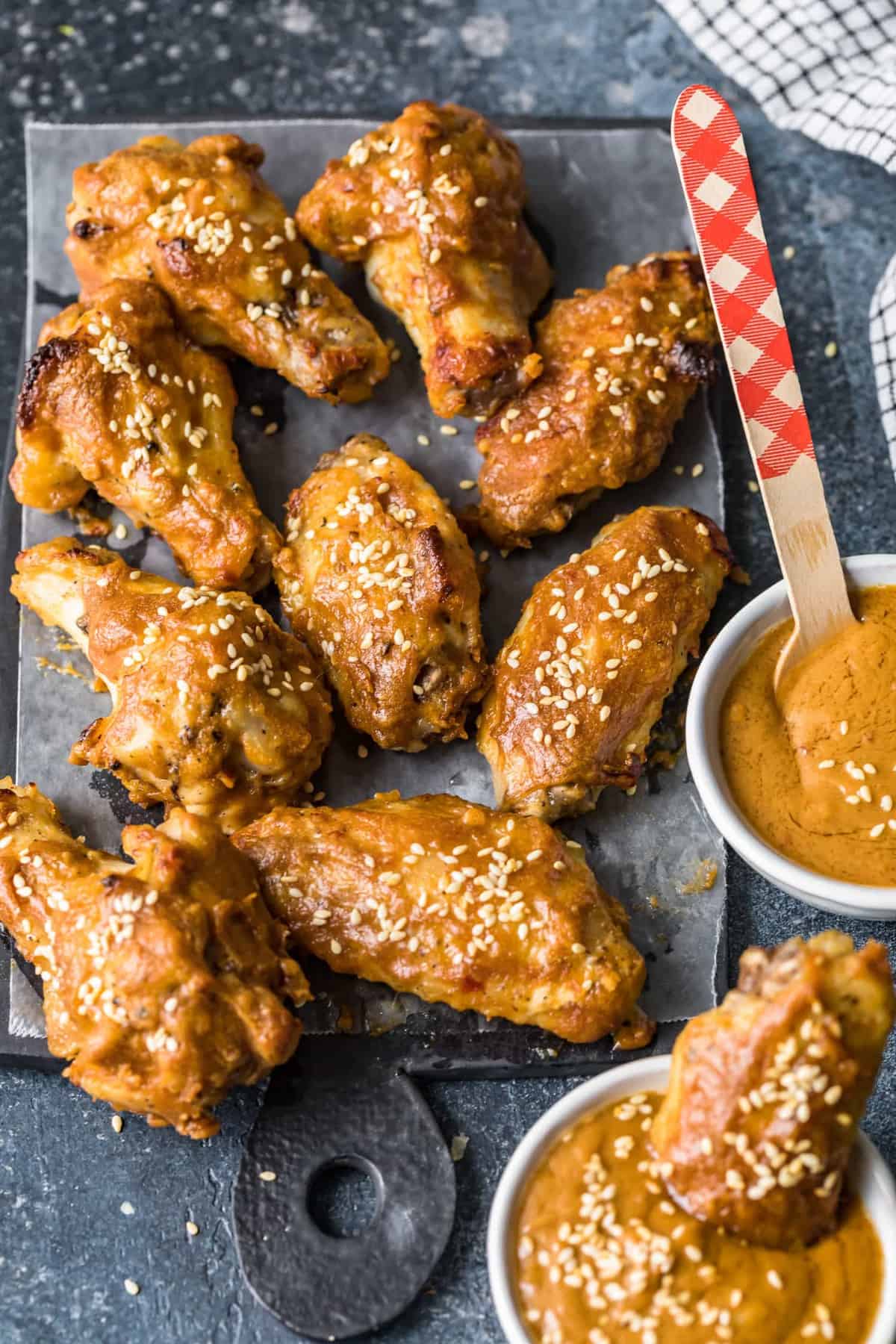 Wings served on a board with dipping sauce