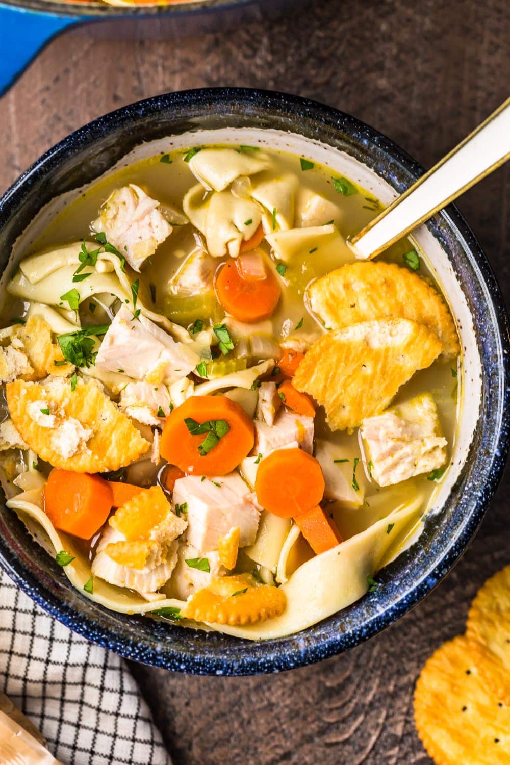 turkey noodle soup served in a bowl with a spoon