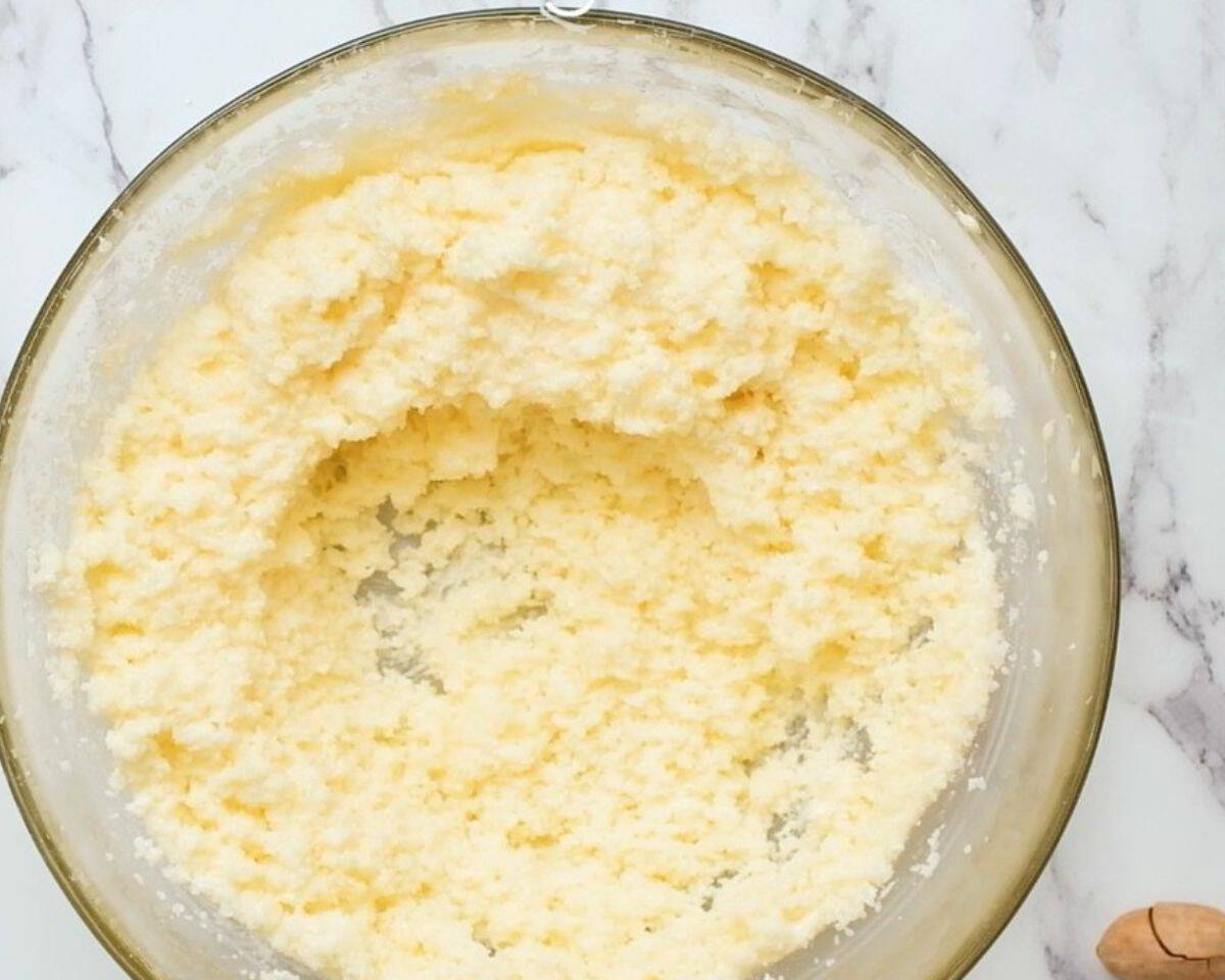 Adding sugar to the butter mixture.