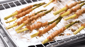 close up of cooked bacon wrapped asparagus spears.
