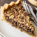 pecan pie slice on a white plate