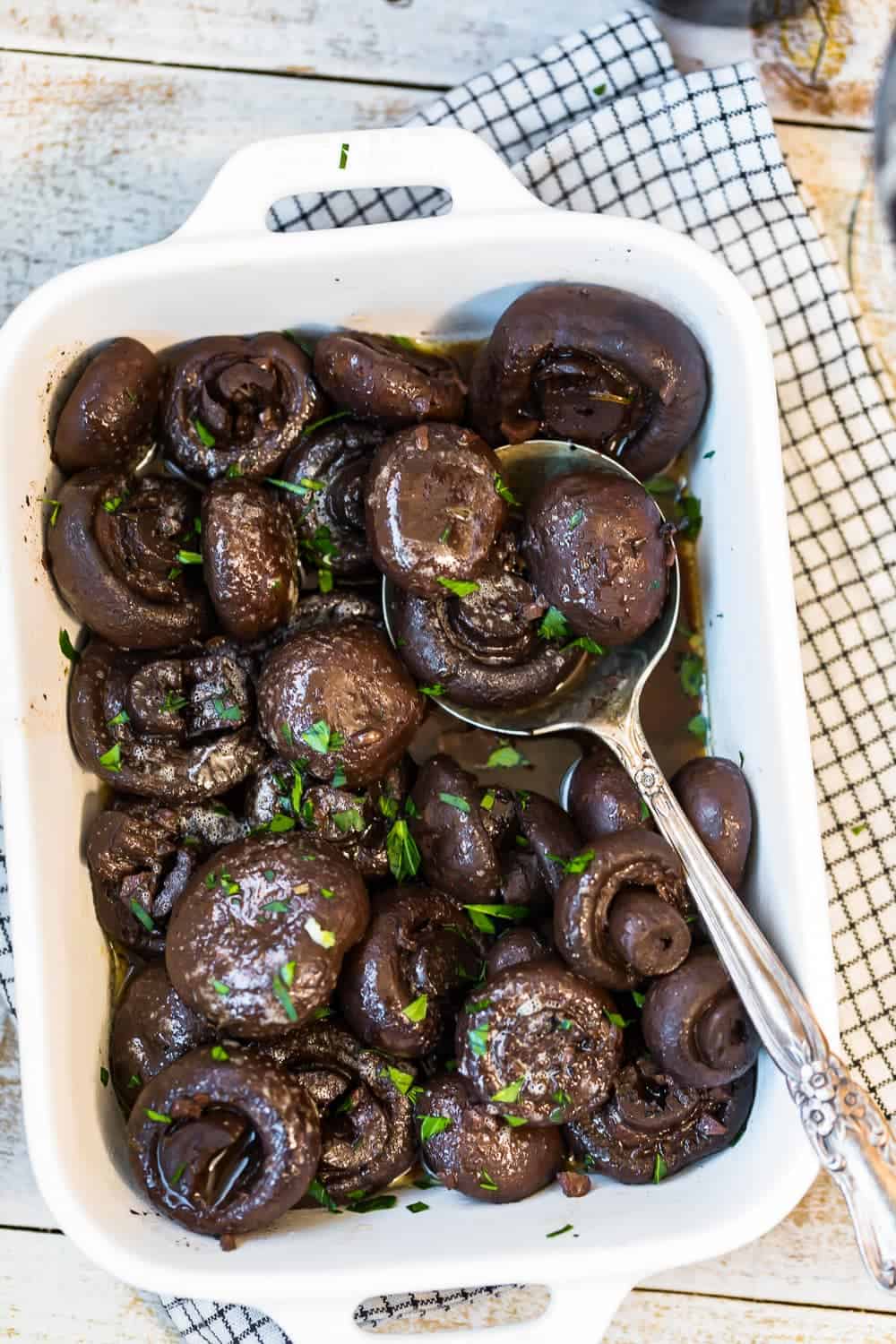 The cooked mushrooms in a serving dish