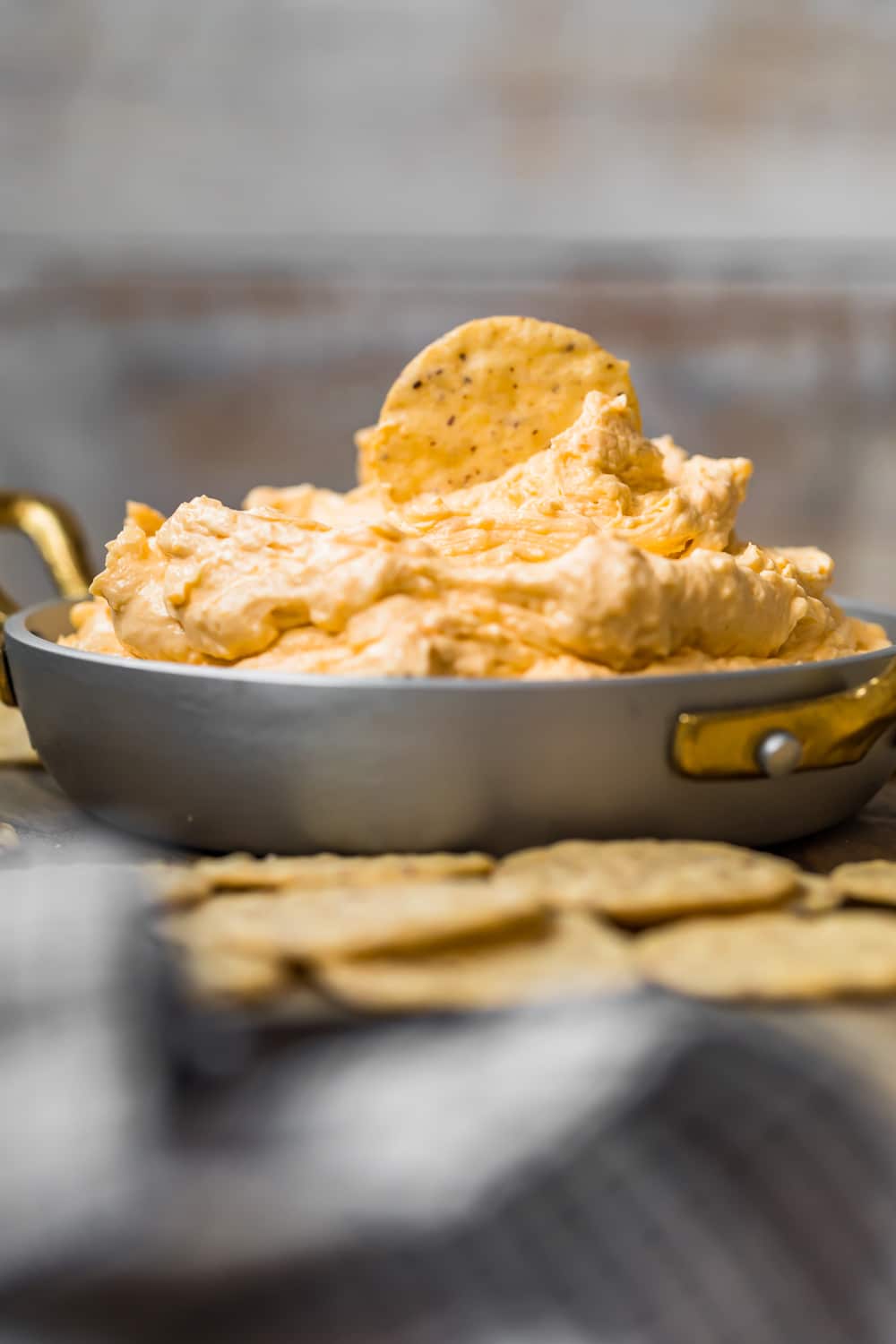 A dip piled high in a silver dish