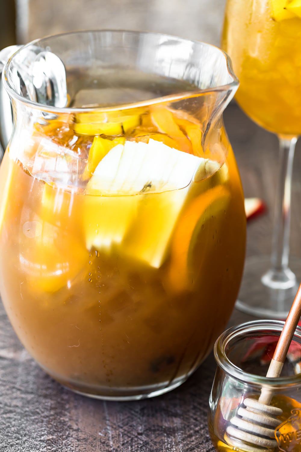 a pitcher of Fall Sangria sitting on a table.