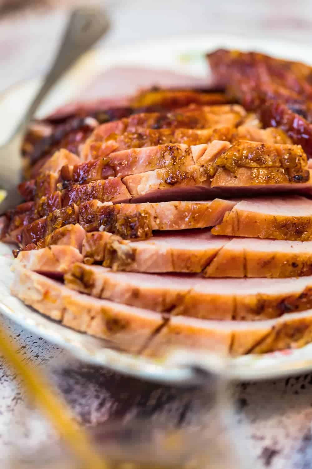Marmalade Glazed Ham sliced on a plate