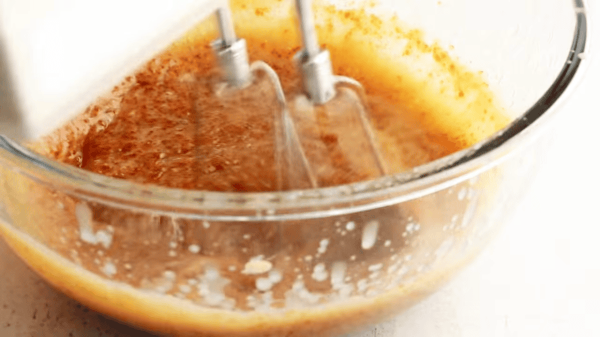 Cream butter and sugars for molasses cookies.