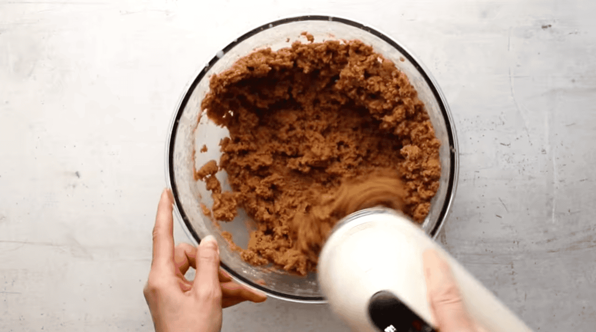 Mixing wet and dry ingredients.