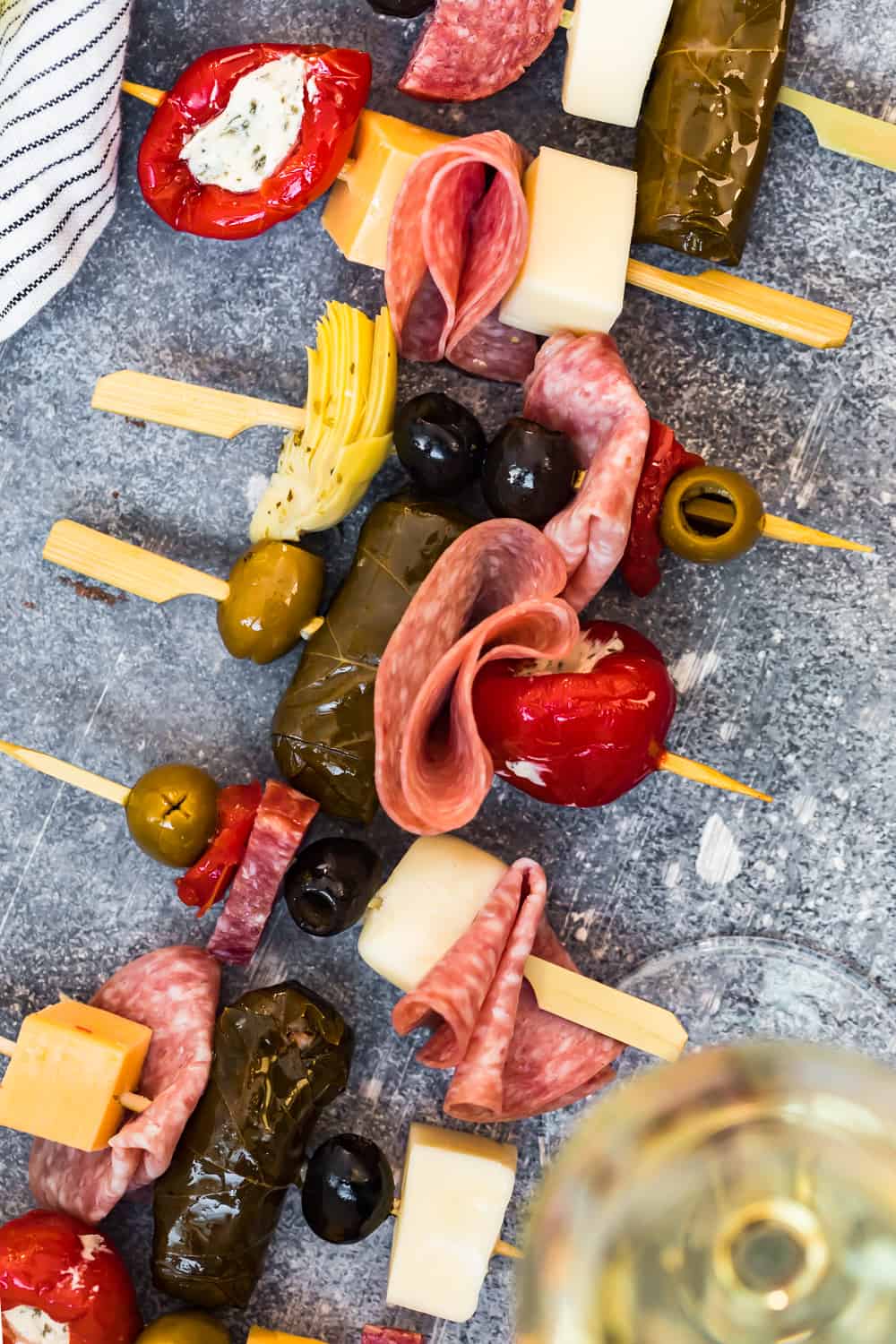 antipasto skewers lined up on a dish