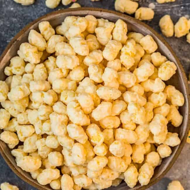 candied corn puff snack mix in bowl