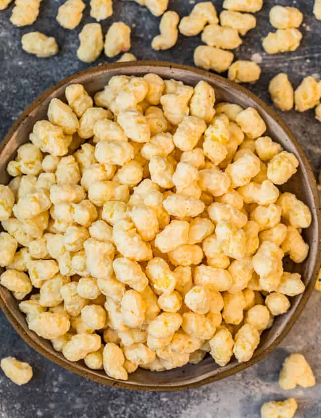 candied corn puff snack mix in bowl