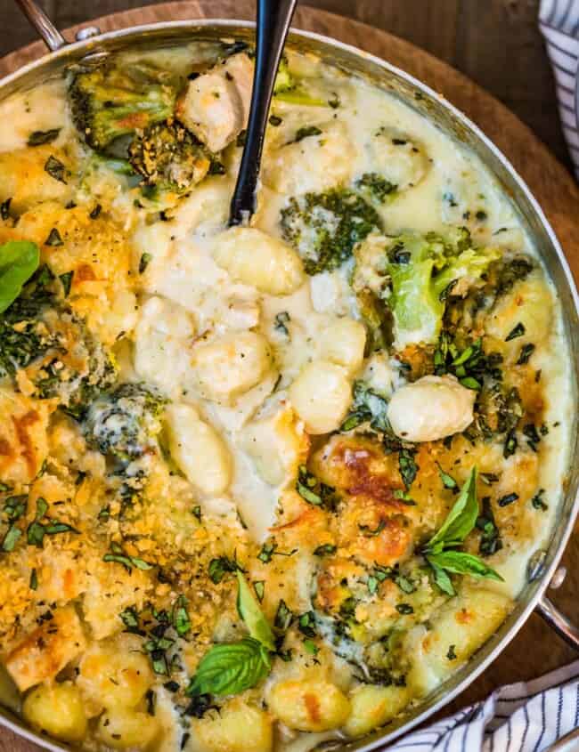 Chicken Alfredo Gnocchi Bake with gnocchi being scooped up