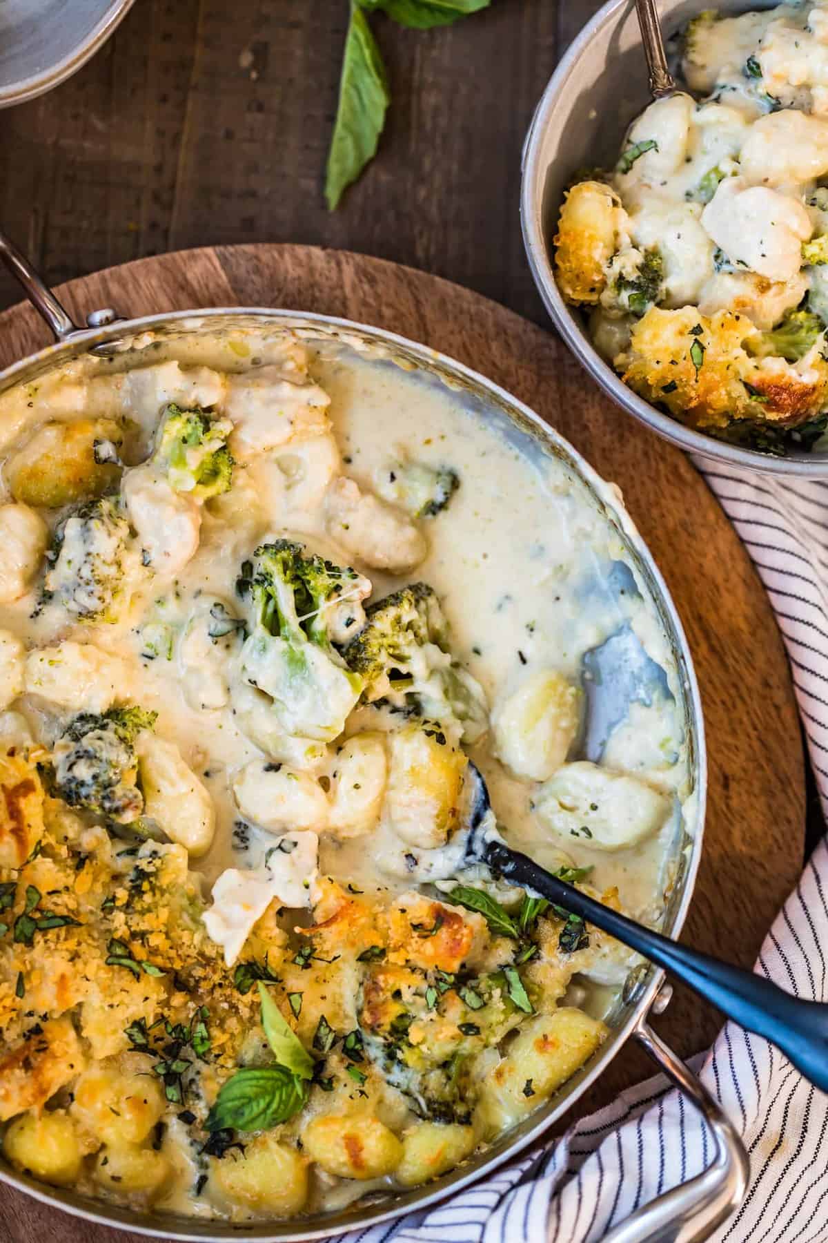 Overhead shot of Chicken Alfredo Gnocchi Bake on wooden table