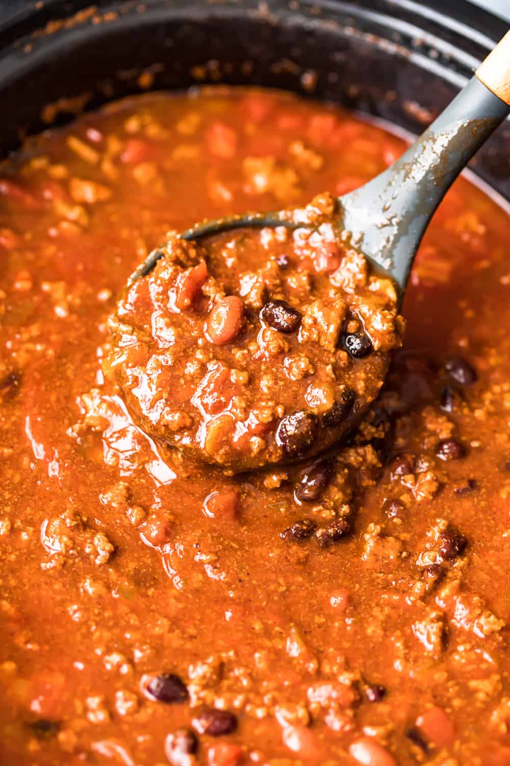 ladle with crockpot chili 