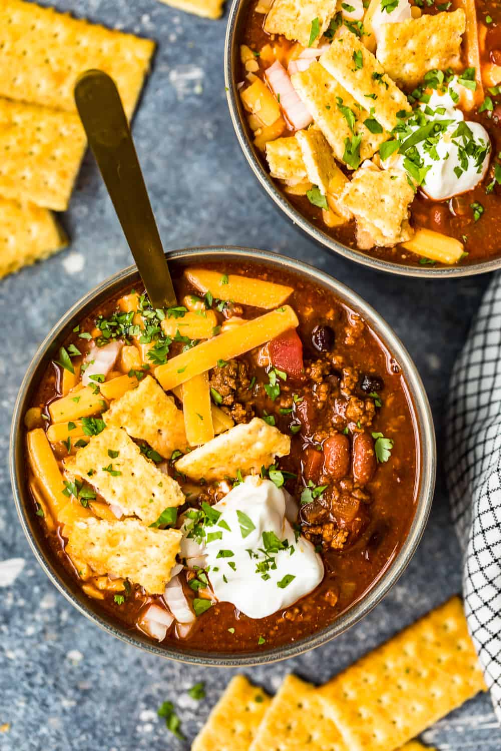 overhead shot of two bowls of chili on a table