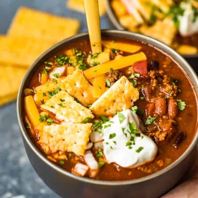 crockpot chili with tortilla chips and crackers.