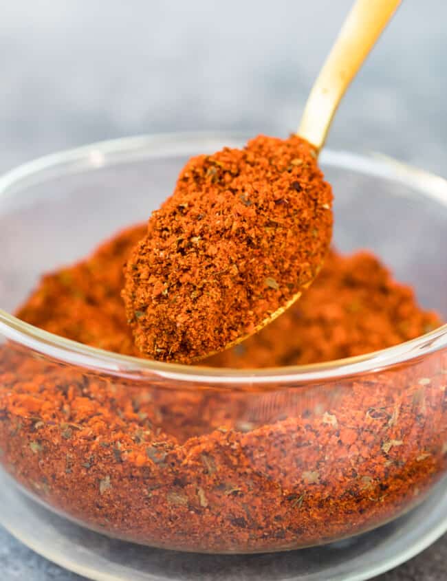 homemade chili seasoning being scooped up with a spoon