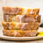 slices of lemon loaf cake stacked on a plate