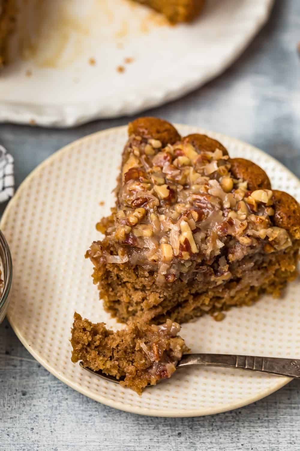 A slice of cake cut into with a fork