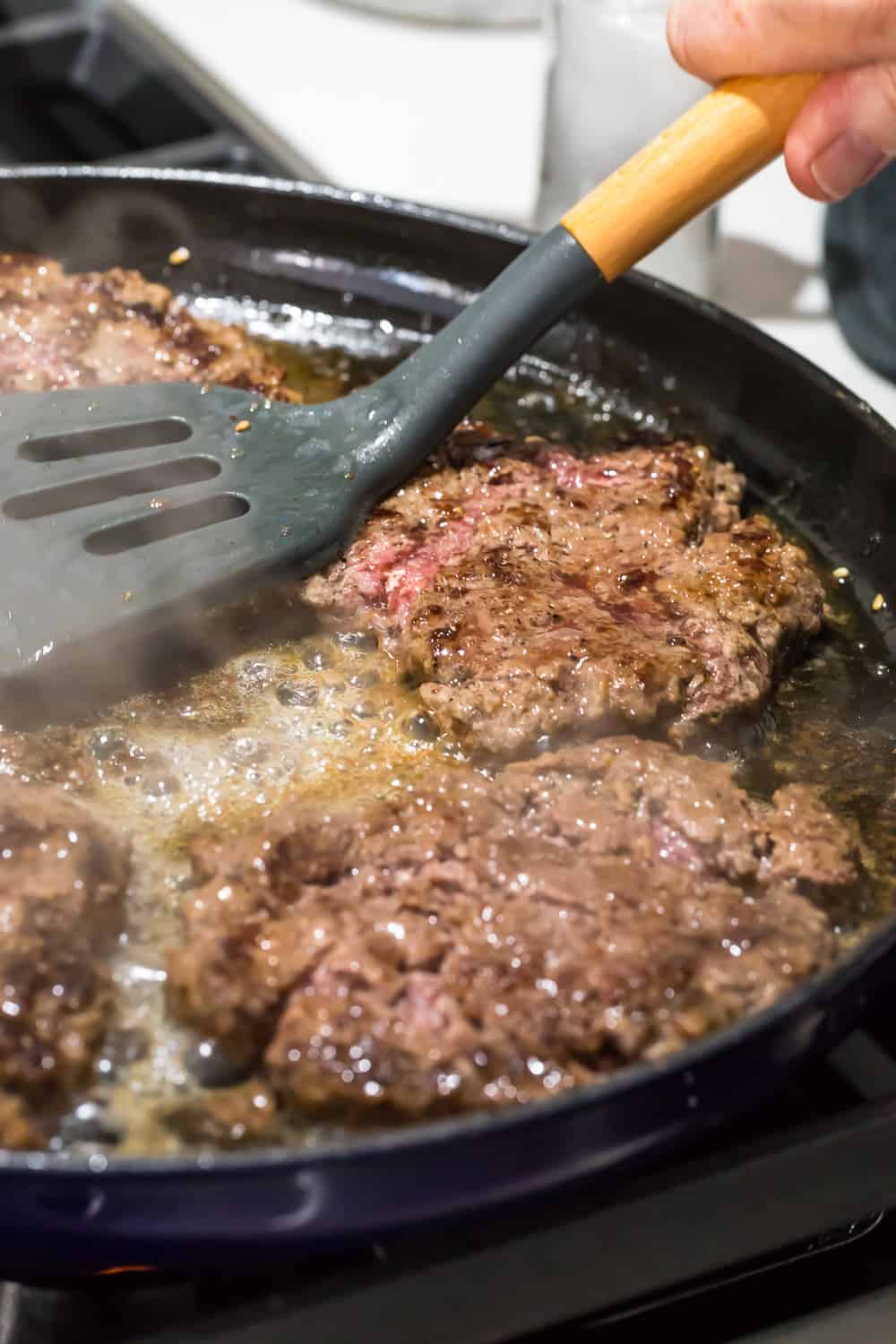 spatula pressing burgers