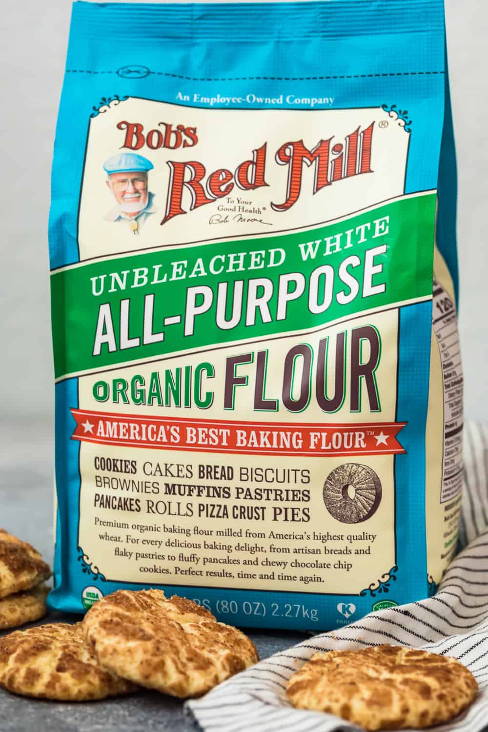 a bag of bob's red mill flour behind some cookies