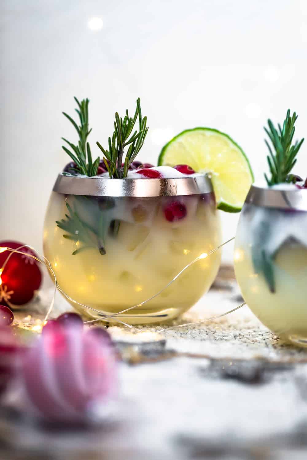 up close image of white christmas tequila sour in glass