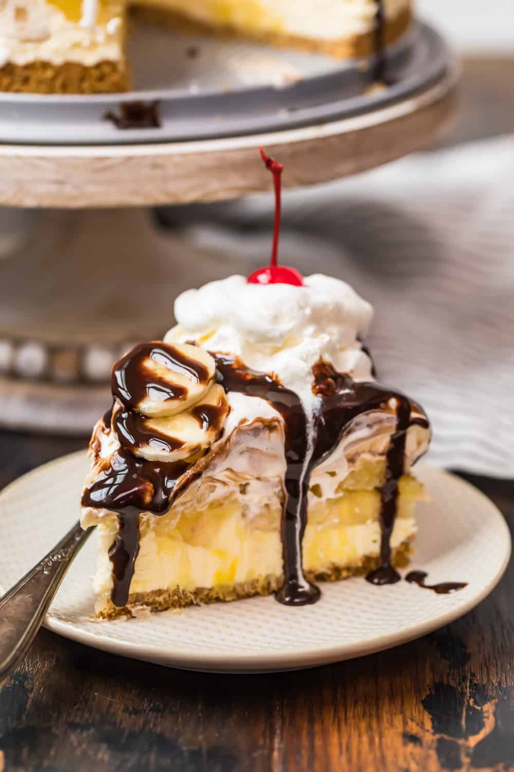 chocolate sauce drizzled on banana split dessert