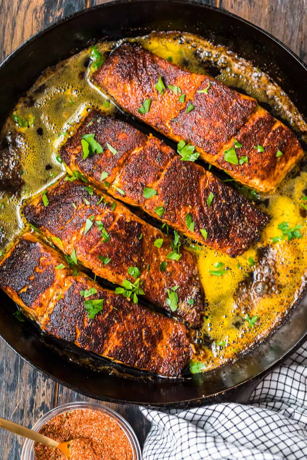 blackened salmons in a skillet