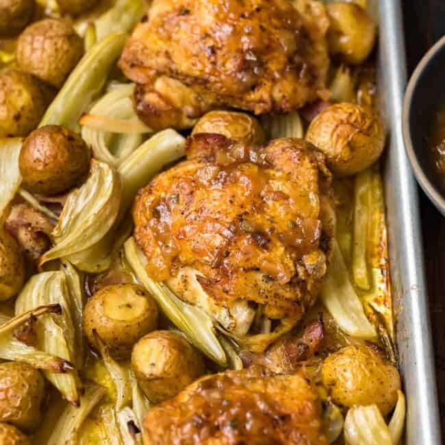 Roast chicken and potatoes baked together on a sheet.