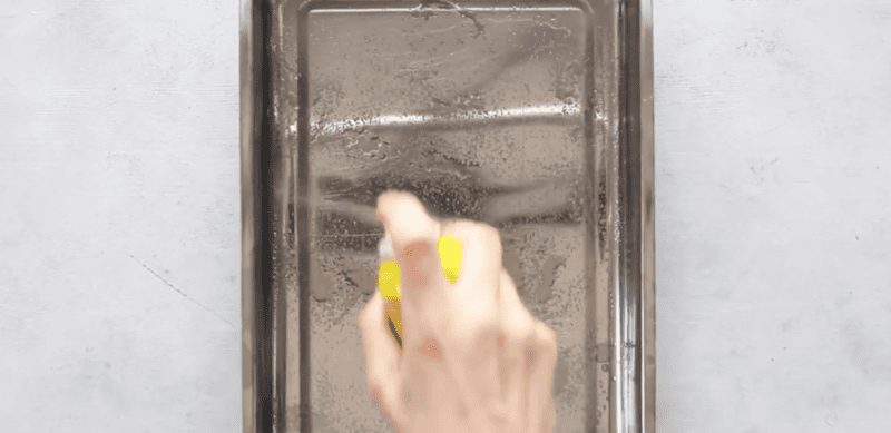 spraying baking dish