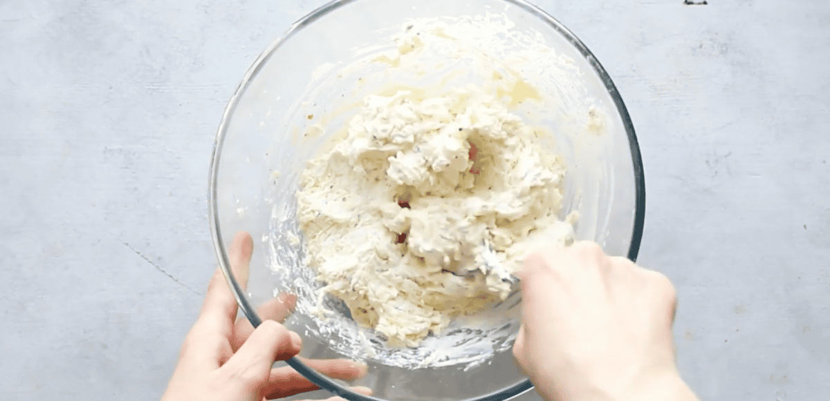 cheeses and seasonings in a glass bowl